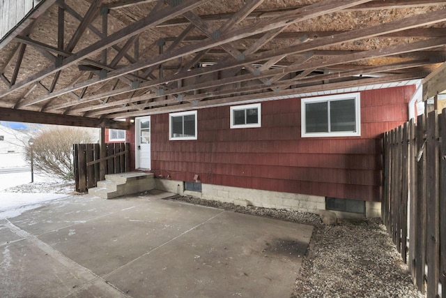 view of home's exterior featuring a patio area and fence