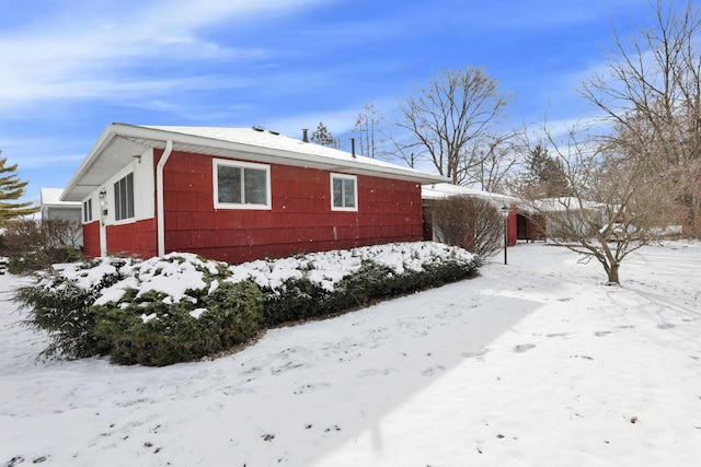 view of snow covered property