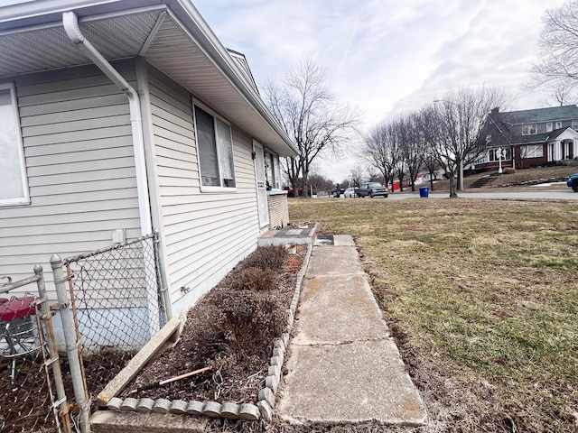 view of side of home with fence