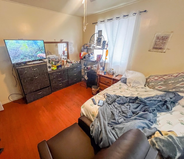 bedroom featuring wood finished floors