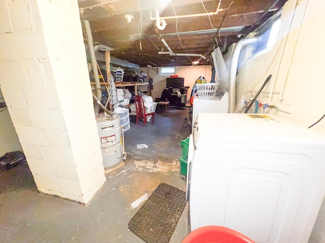 basement with washer / dryer and water heater