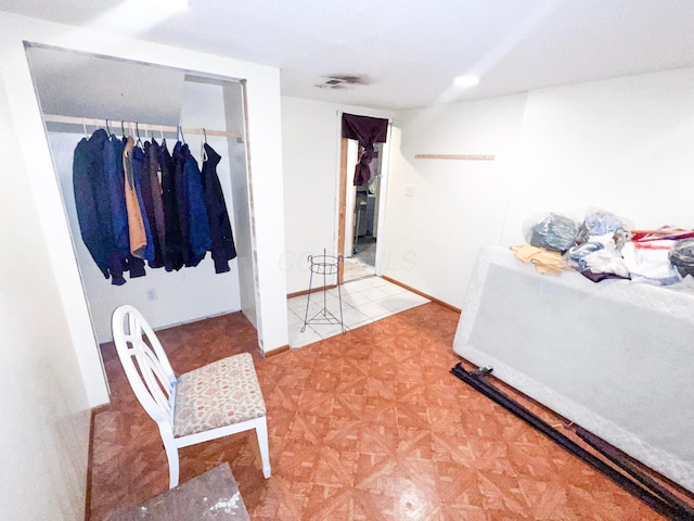 bedroom with a closet and baseboards