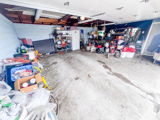 garage featuring concrete block wall