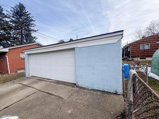 detached garage with fence