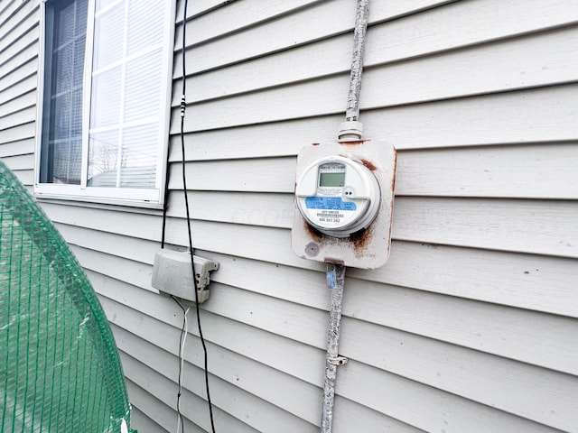 exterior details featuring electric meter