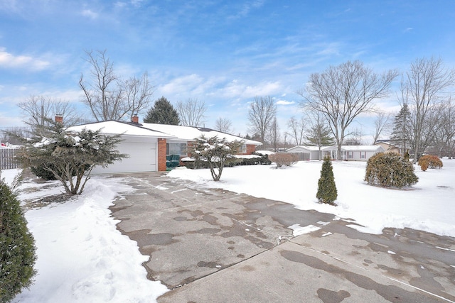 exterior space featuring driveway and an attached garage