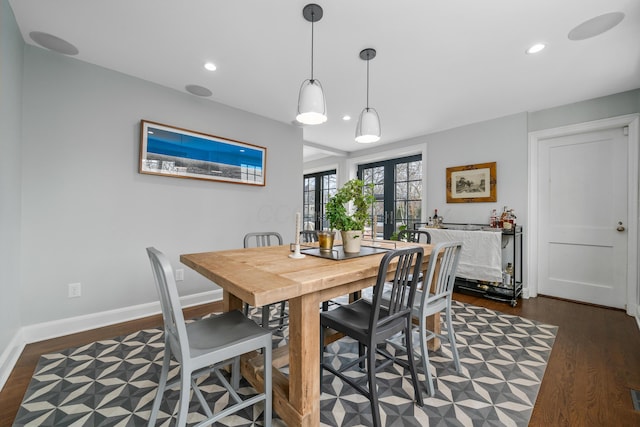 dining room with french doors, dark wood-type flooring, recessed lighting, and baseboards