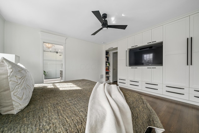 bedroom featuring connected bathroom, dark wood finished floors, and ceiling fan