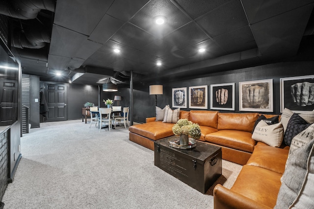 living area featuring carpet floors and recessed lighting