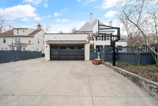 exterior space featuring a chimney and fence