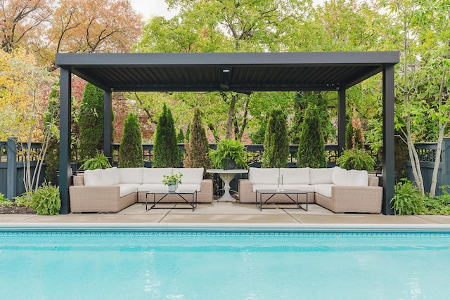 pool featuring fence and an outdoor living space