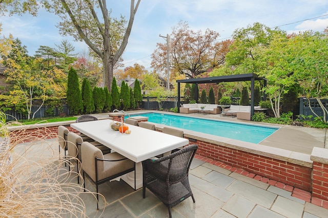 view of pool with a fenced in pool, outdoor lounge area, outdoor dining space, a patio area, and a fenced backyard