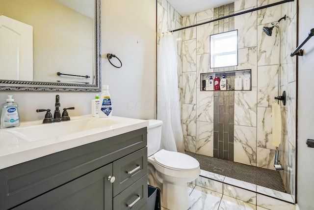 full bathroom with toilet, marble finish floor, a stall shower, and vanity