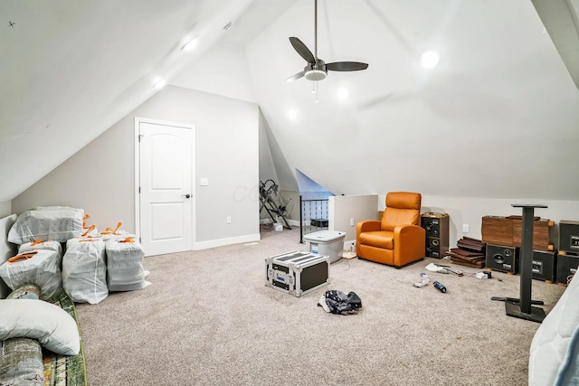 interior space featuring vaulted ceiling, a ceiling fan, and baseboards