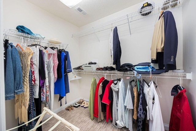 spacious closet featuring carpet floors and visible vents