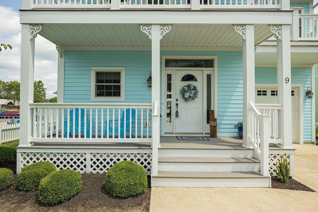 view of exterior entry featuring a porch