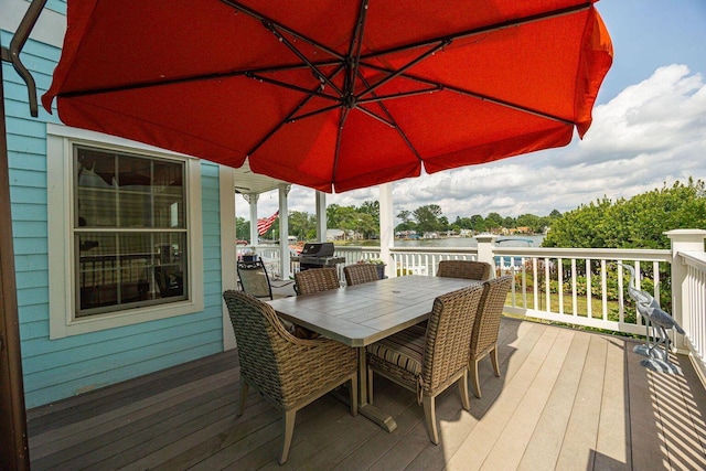 wooden deck with outdoor dining area