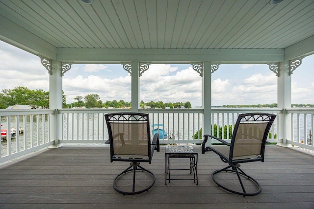 wooden terrace with a water view