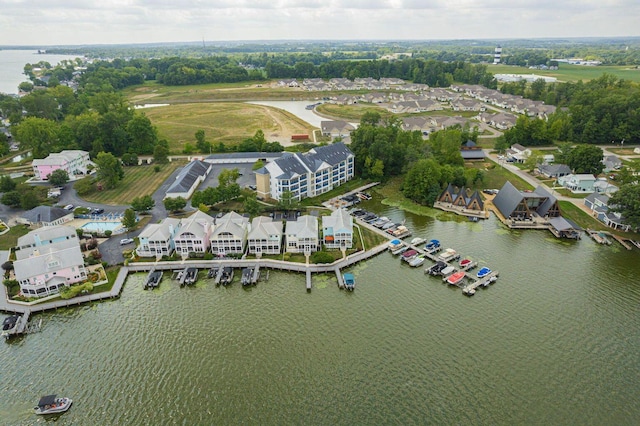 drone / aerial view with a water view and a residential view