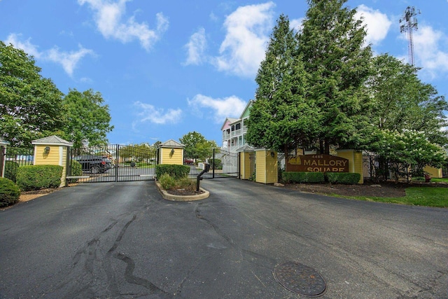 view of street featuring a gate and a gated entry