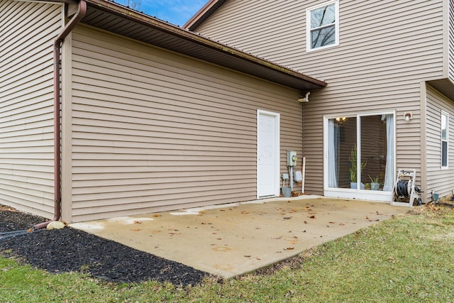 back of house with a patio