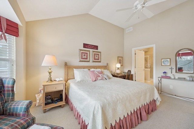 bedroom with carpet, multiple windows, visible vents, and vaulted ceiling