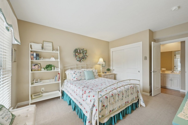 bedroom featuring carpet, baseboards, and a closet