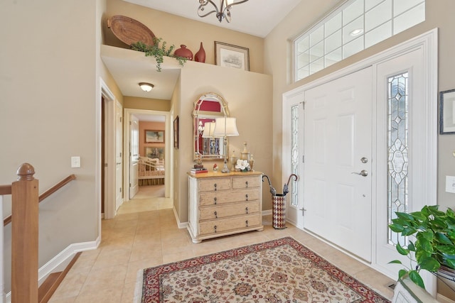 entryway featuring light tile patterned floors and baseboards