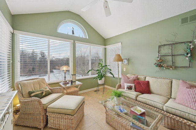 living area featuring visible vents, a ceiling fan, light tile patterned flooring, vaulted ceiling, and baseboards