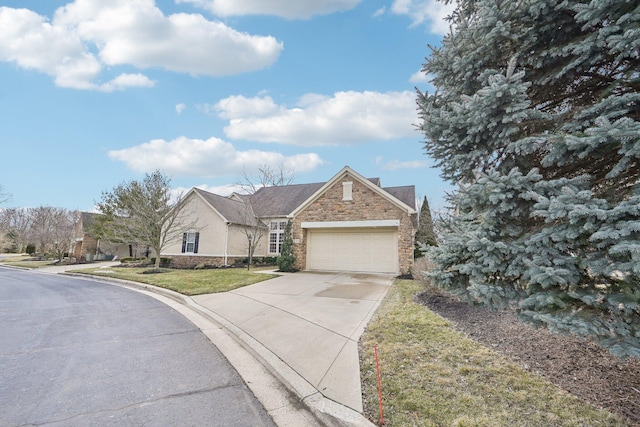 view of front of house with a garage, a residential view, stone siding, driveway, and a front lawn