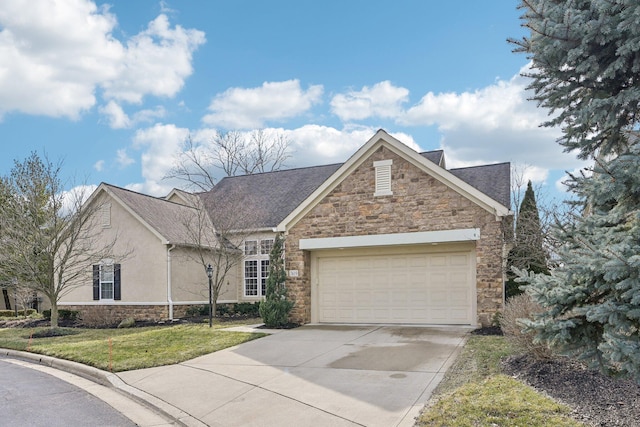 view of front facade featuring stucco siding, concrete driveway, an attached garage, a front yard, and stone siding