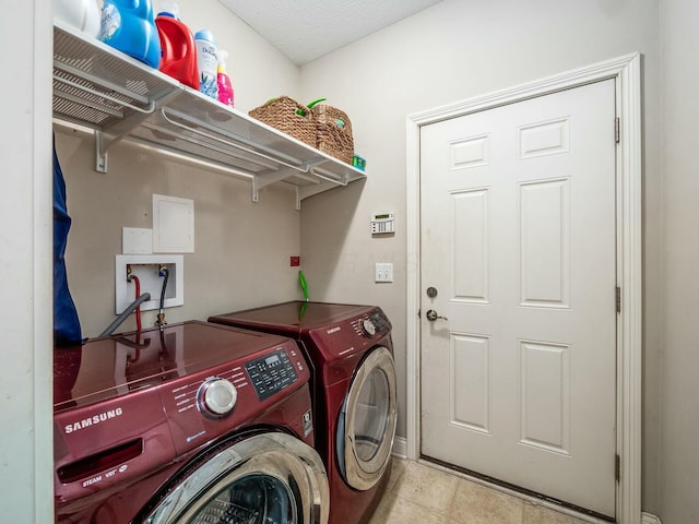 clothes washing area with laundry area and washer and dryer