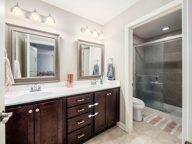 ensuite bathroom featuring connected bathroom, a stall shower, a sink, and toilet