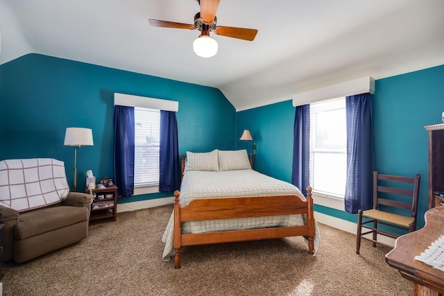 bedroom featuring a ceiling fan, carpet flooring, and vaulted ceiling