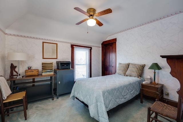 bedroom featuring lofted ceiling, carpet, a ceiling fan, and wallpapered walls