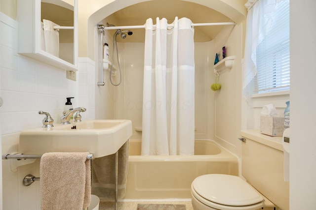 bathroom featuring toilet, shower / tub combo, tasteful backsplash, and tile walls