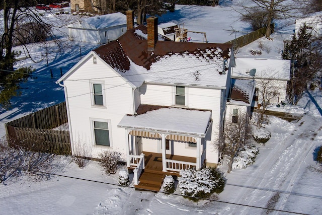 view of front of property with fence and a porch