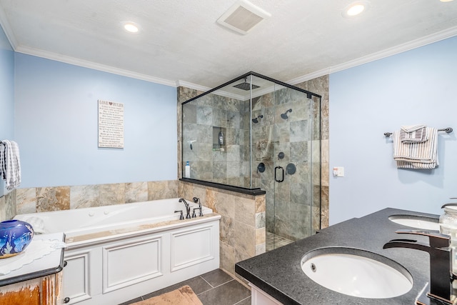 full bath with ornamental molding, a sink, visible vents, and a shower stall