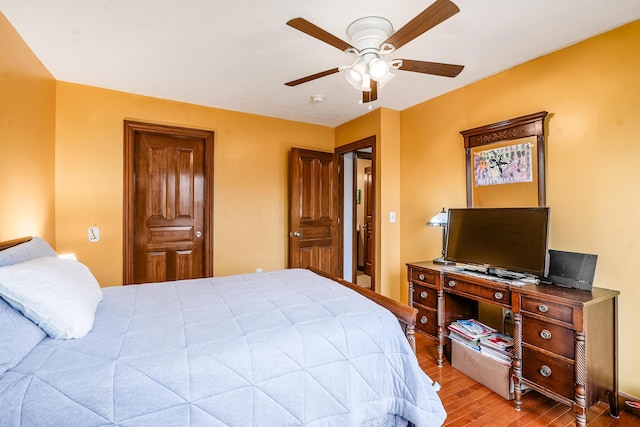 bedroom featuring ceiling fan and wood finished floors