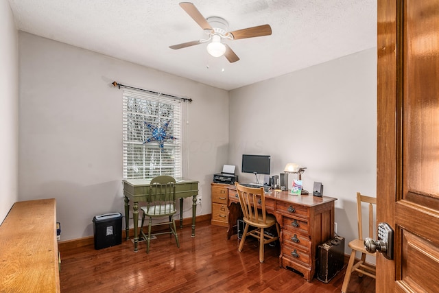 office with a ceiling fan, dark wood-style flooring, a textured ceiling, and baseboards