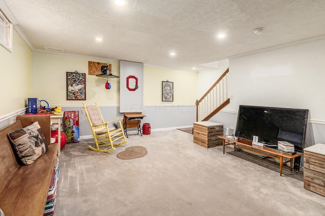 game room with a textured ceiling, carpet flooring, and visible vents