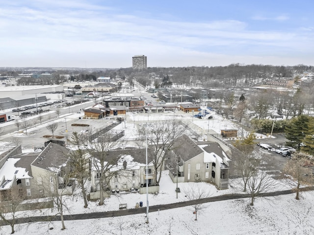 snowy aerial view with a residential view