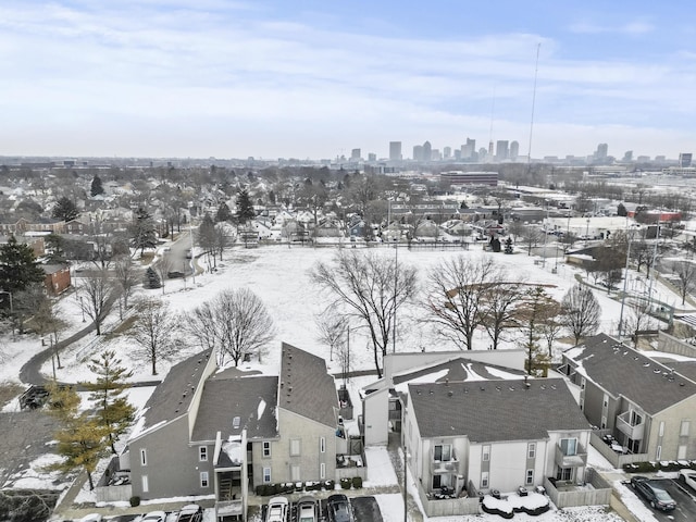 snowy aerial view with a view of city and a residential view