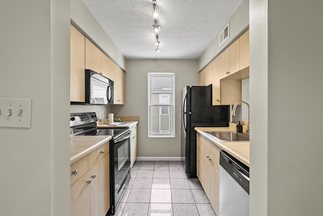 kitchen featuring electric range, dishwasher, light countertops, light brown cabinetry, and black microwave