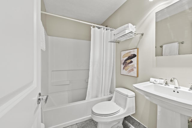 full bathroom featuring toilet, a sink, and shower / bath combination with curtain