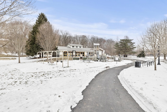 snow covered house with playground community