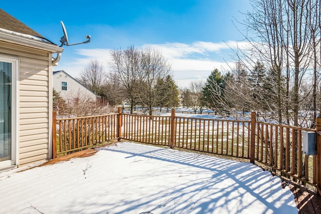 view of snow covered deck