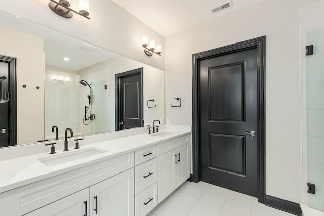 full bathroom featuring a stall shower, visible vents, a sink, and double vanity