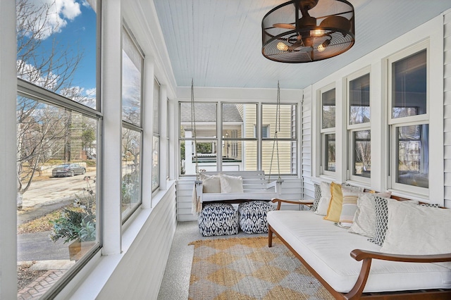 sunroom featuring ceiling fan