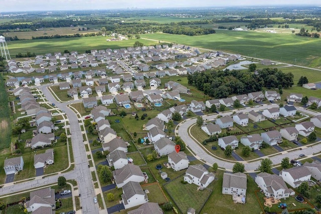 birds eye view of property with a residential view